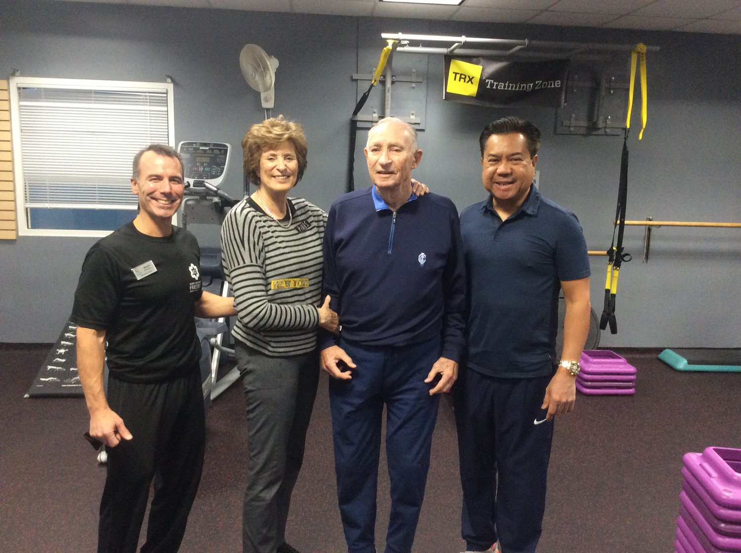 JCC personal trainer Rocco Perrrotta, Alzheimer’s disease patient Armand Lindenbaum and his wife, Jean, along with Armand’s caretaker, Michael Alunan