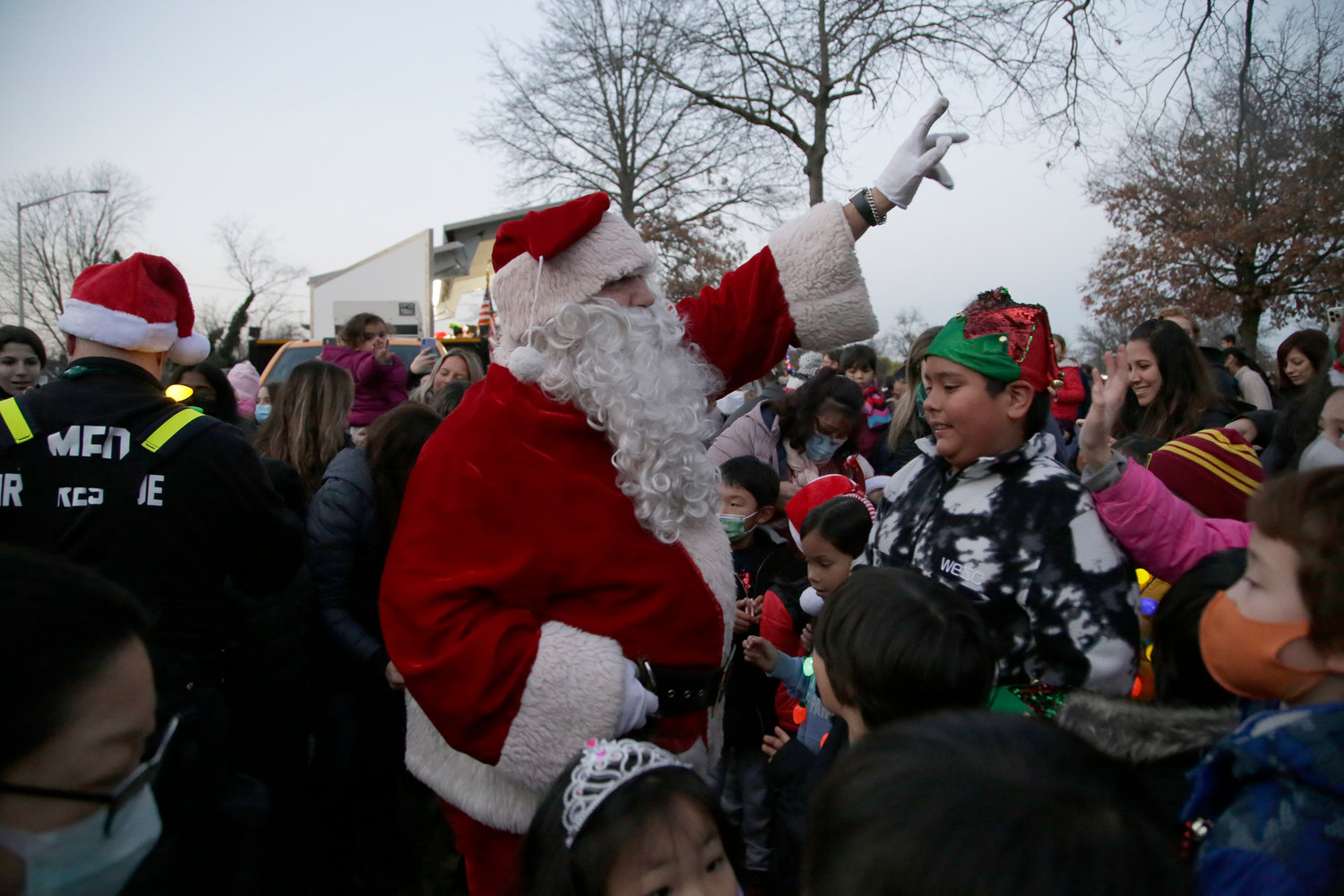 When Santa arrived, jubilant children surrounded him.