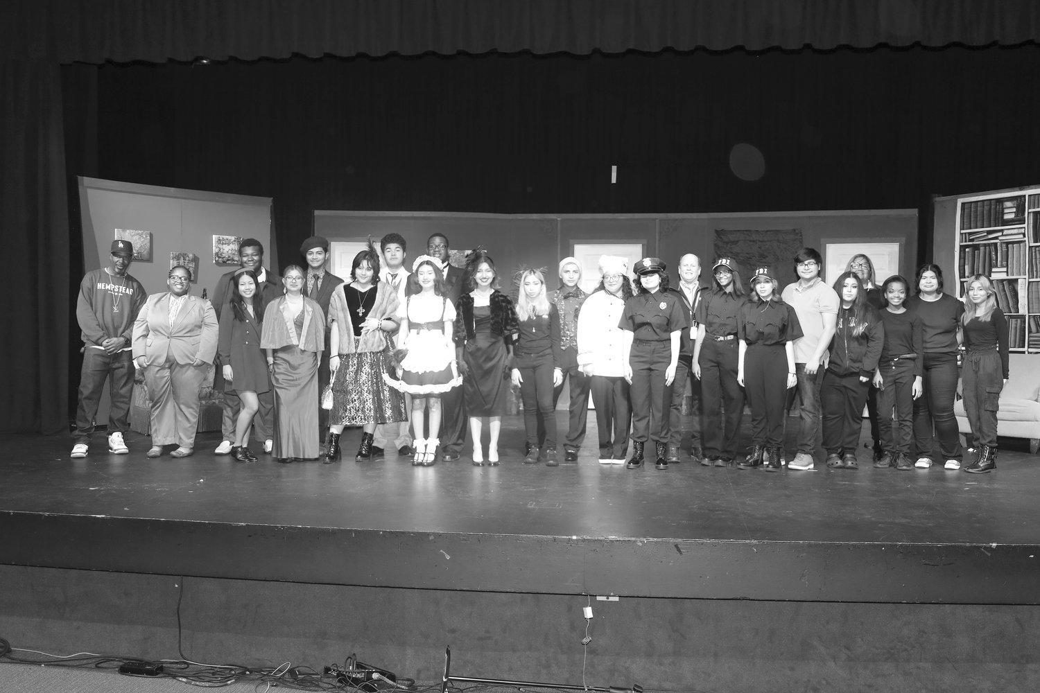 The cast and crew of “Clue” at Hempstead High appears in this photo with director and theater instructor Timothy Dolan, ninth from right.