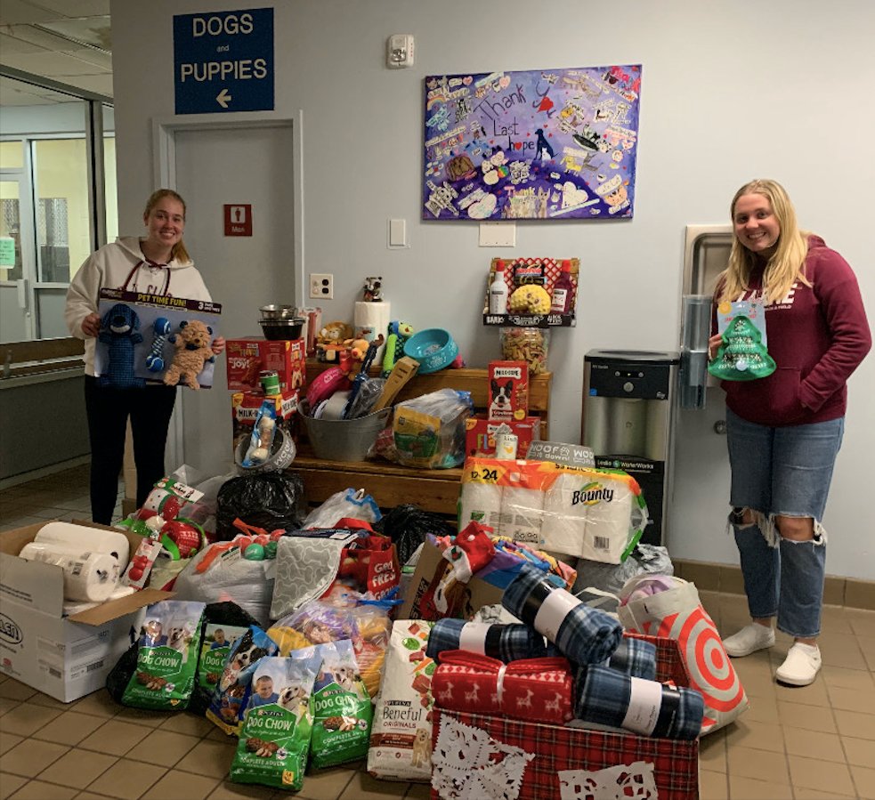 Brooke, left, and Ella Noonan brought donations to Last Hope Animal Shelter on Dec. 15 after their club collected supplies.