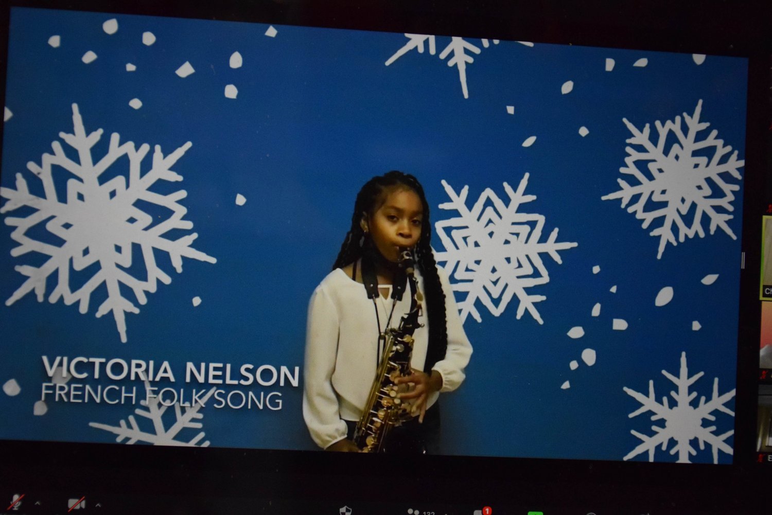 A video clip of Alden Terrace School student Victoria Nelson performing the saxophone was played during the Zoom event.