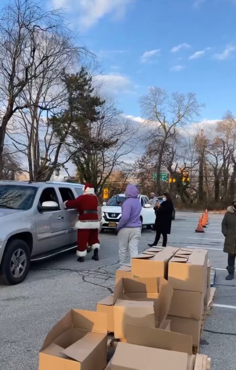 Santa and his elves helped hand out boxes of food so local families could have a holiday meal.