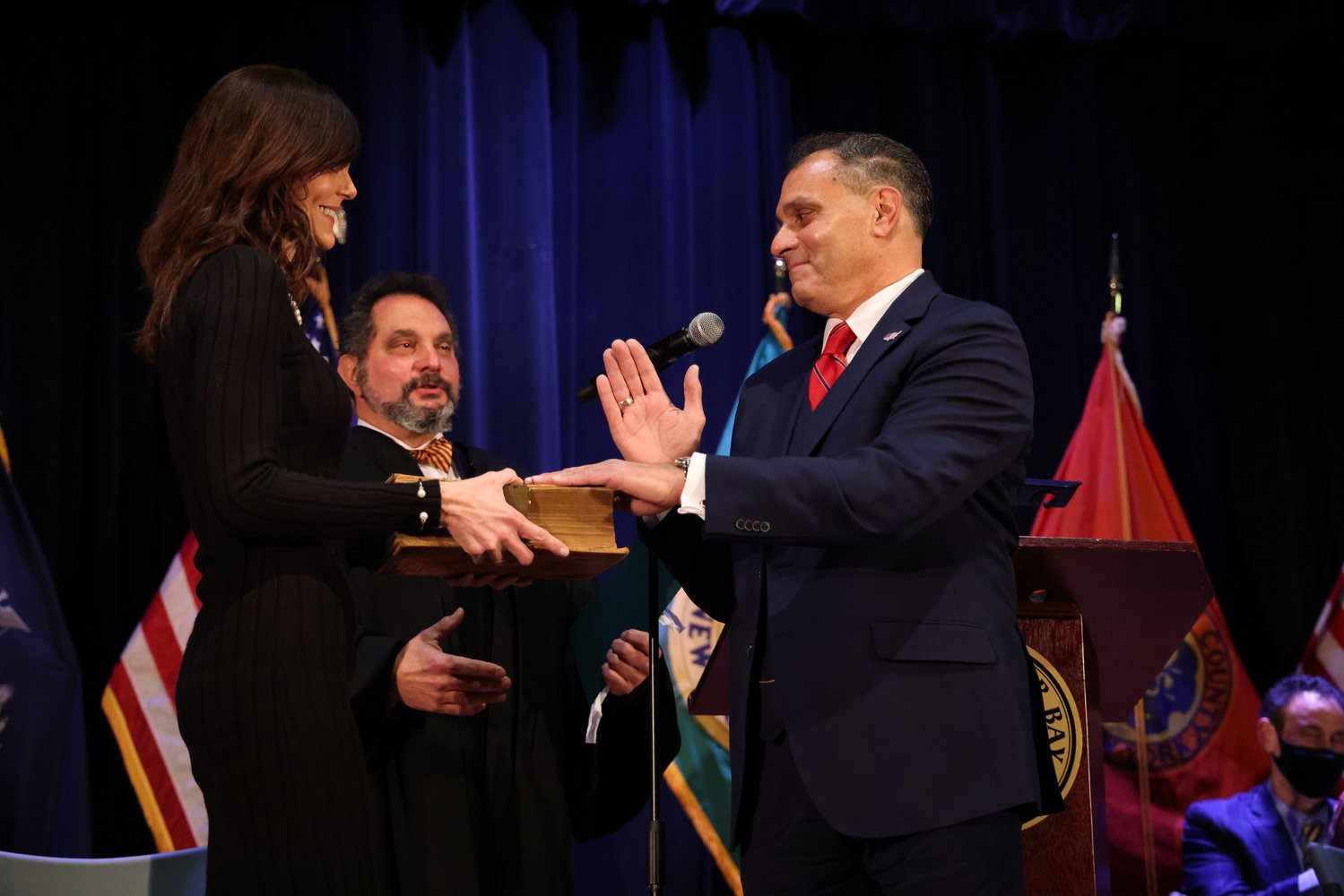 Supervisor Joseph Saladino’s brother, Judge James Saladino, left, installed his brother with Halina Howlett holding the Bible at Wednesday’s induction ceremony.