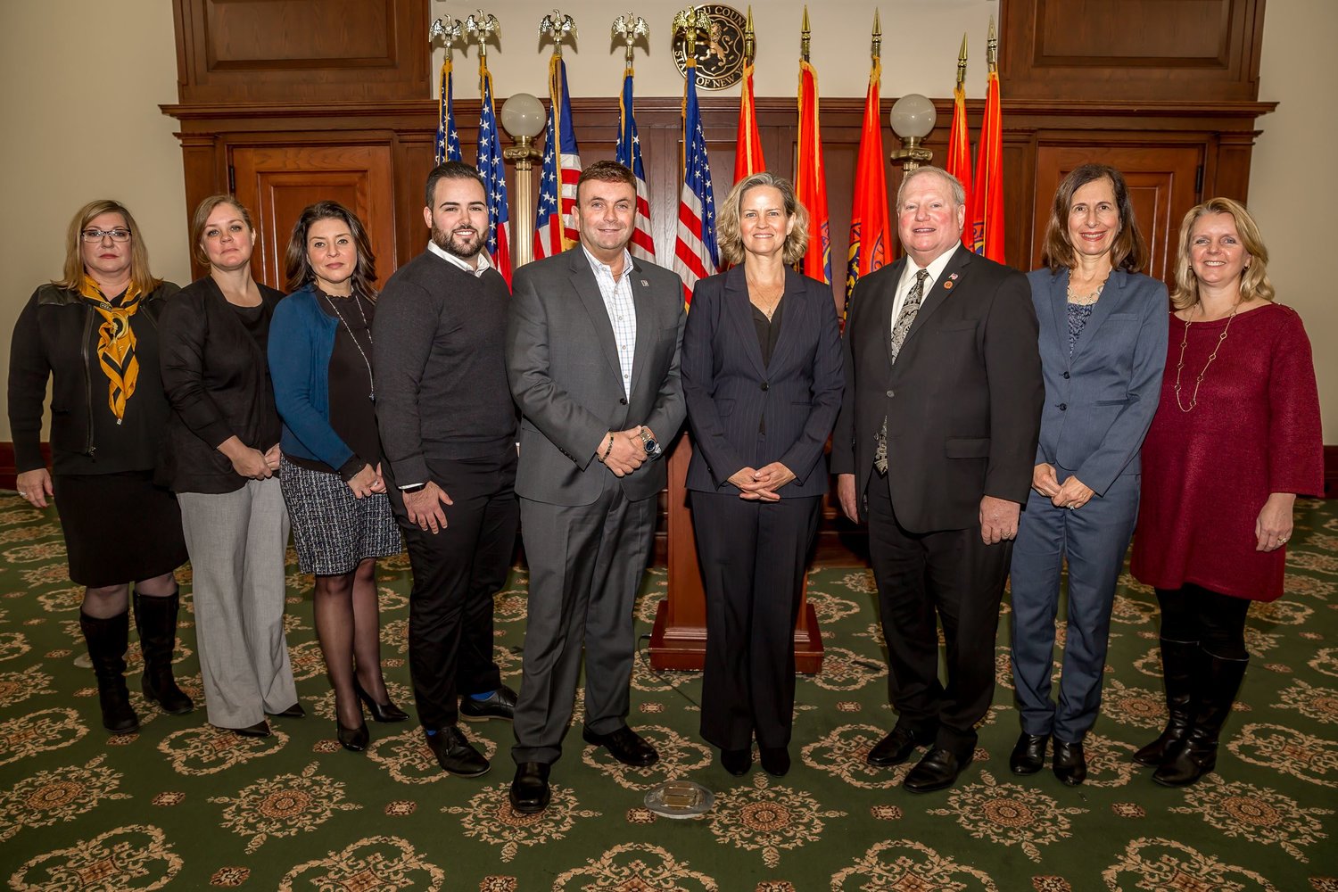 Surrounded by Nassau County legislators and officials, former County Executive Laura Curran, fourth from right, announced her formation of the Nassau County Advisory Committee for Gender Inclusivity on Dec. 30, 2021.