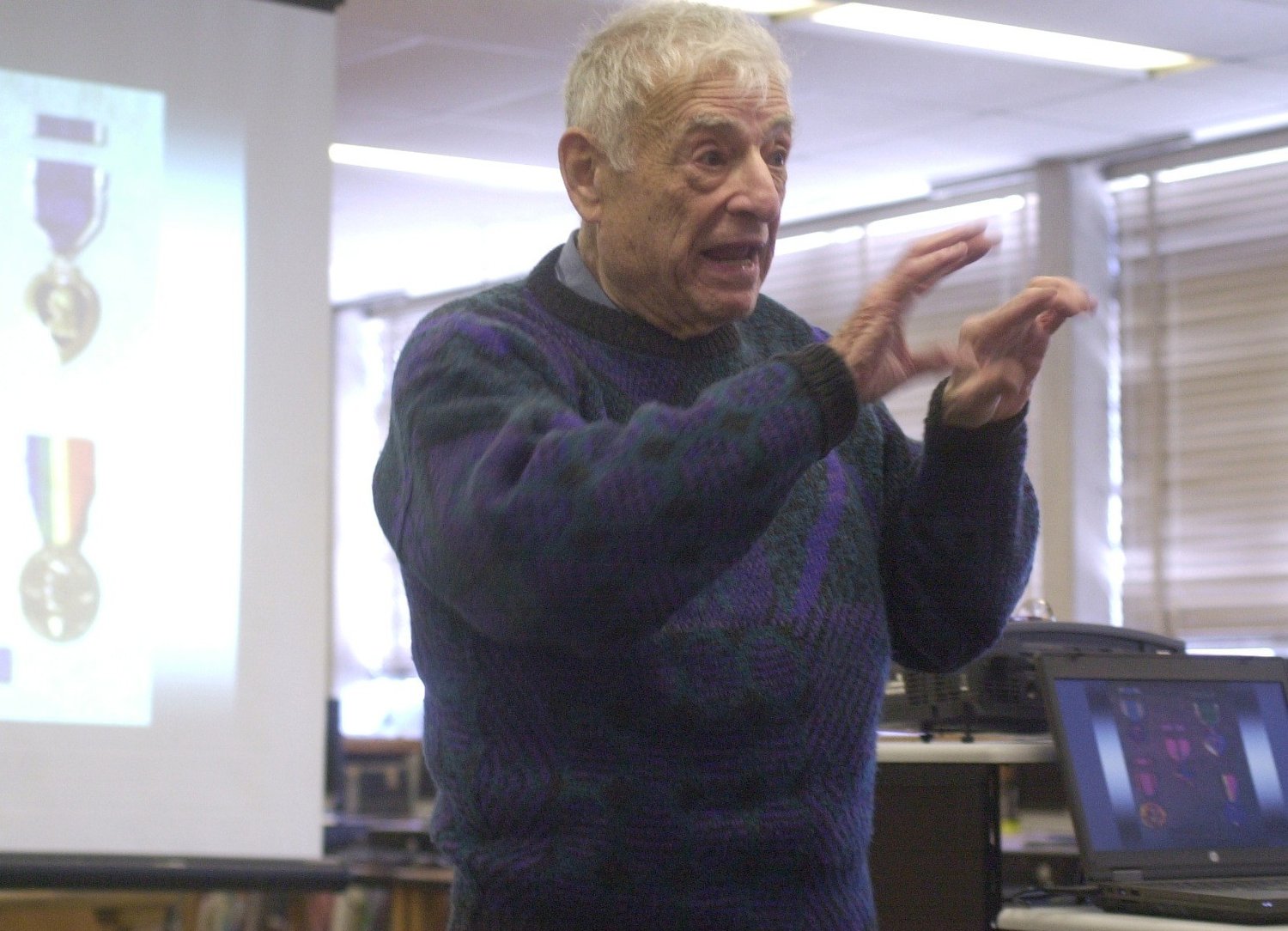 World War II hero Bernard Rader of Freeport delivered a talk about his harrowing experiences in battle at Kennedy High School in Bellmore in 2013.