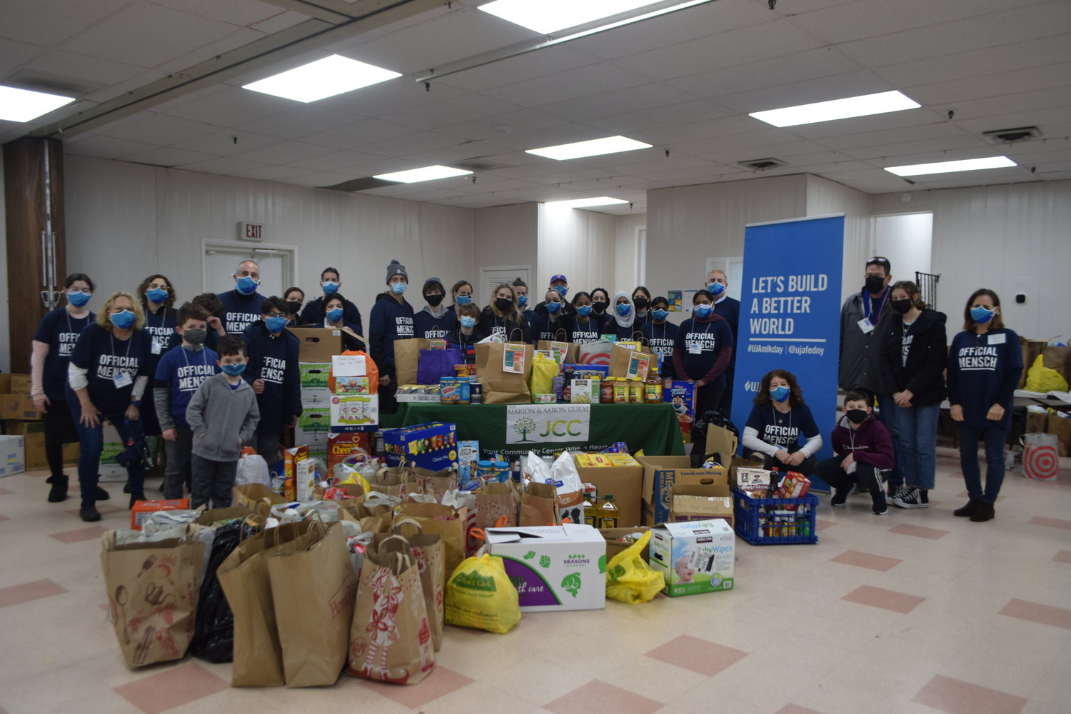 Gural JCC officials, volunteers and a whole lot of donated food.