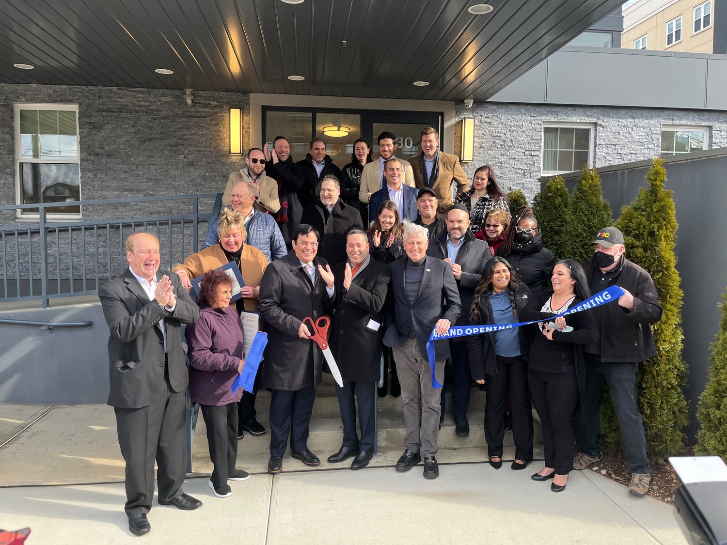 Esplanade owners and operators Alexander and David Scharf cut the grand opening ribbon for Esplande senior community in Woodmere on Jan. 18.