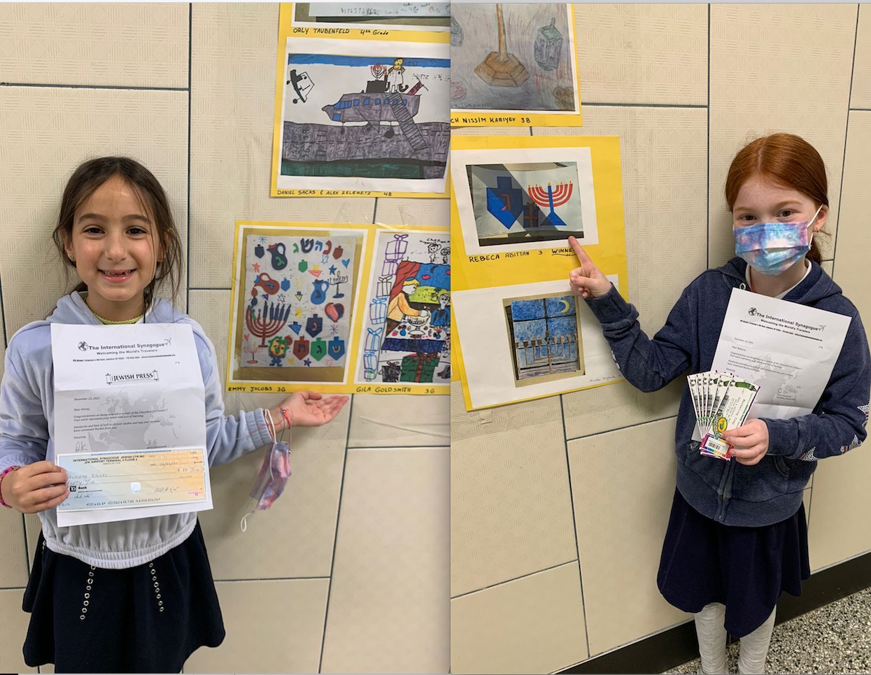 Emmy Jacobs, left,  with her contest prize and winning artwork and Rebecca Abbitan held her tickets and pointed to her illustration.