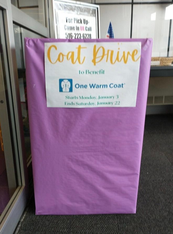 The purple Coat Drive box is unmissable once a patron enters the library.