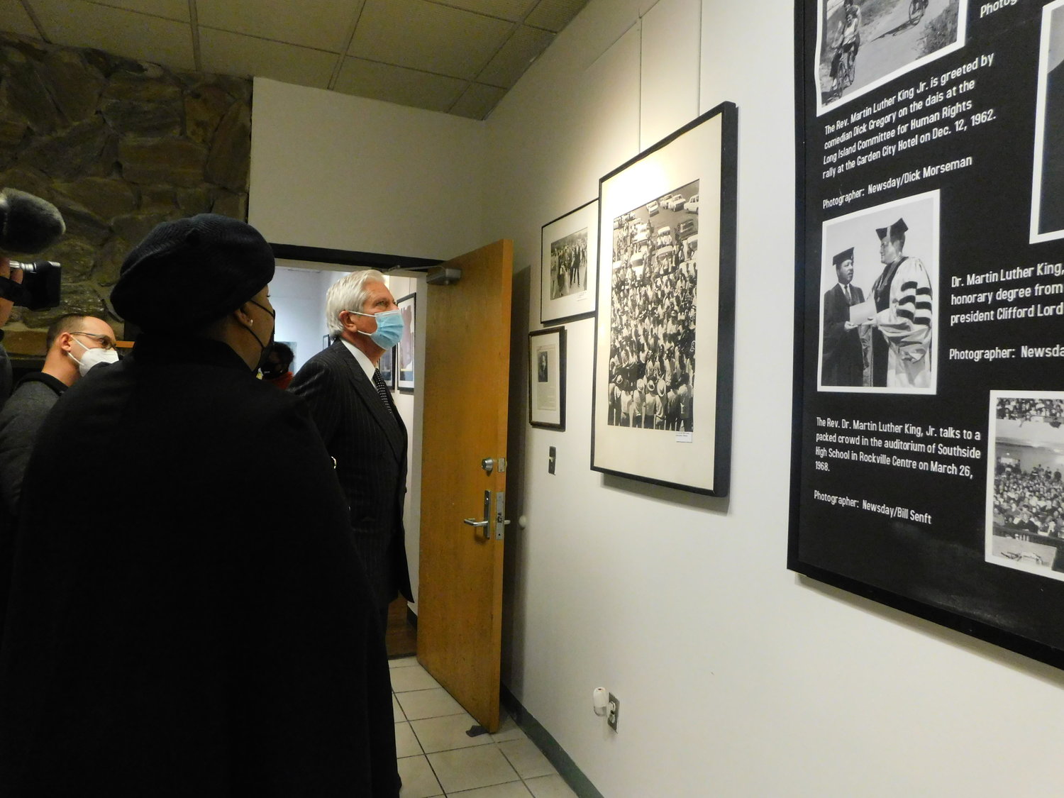 Nassau County Executive Bruce Blakeman examined a display about Martin Luther King Jr. at the Joysetta and Julius Pearse African American Museum of Nassau County prior to a commemorative program in the museum's auditorium ].