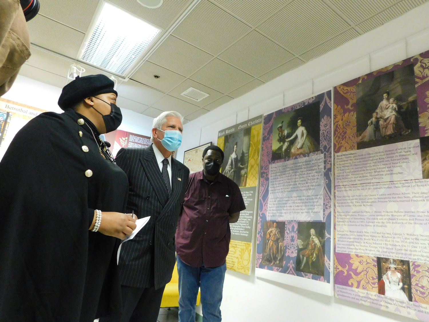 Monet Green, left, and Anthony Richards, right, showed County Executive Bruce Blakeman a display in the Royals Room of the Joysetta and Julius Pearse African American Museum of Nassau County on Jan. 17, Martin Luther King Jr. Day.