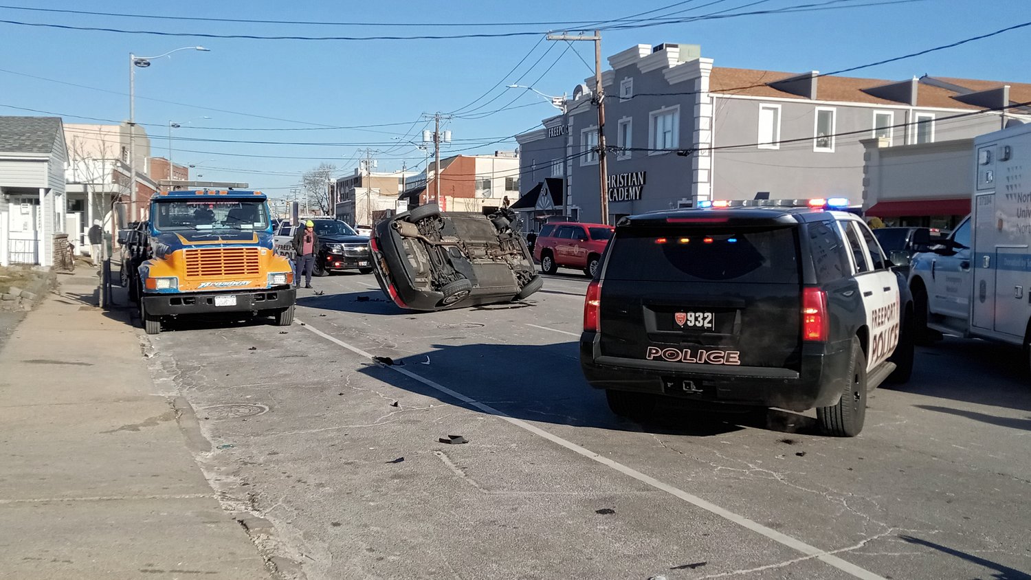 Freeport police responded on Saturday morning, Jan. 22, when called to a collision between a tow truck, left, and an SUV, which flipped onto one side.
