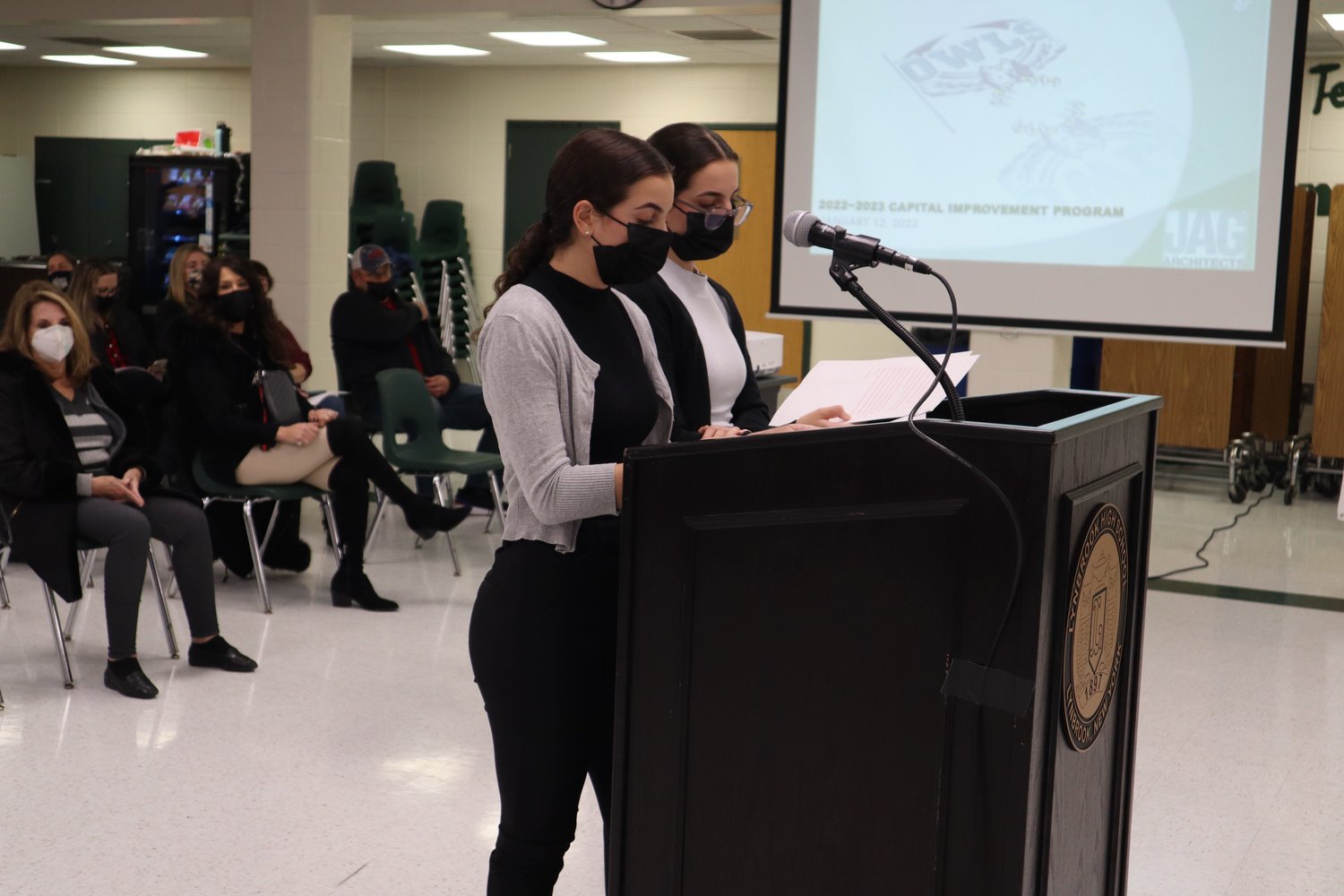 Reading a letter on behalf of the Lynbrook High School Student Government Association at the Jan. 12 Board of Education meeting, Emma, left, and Sophie Ward urged Lynbrook school officials to allow quarantining students to learn remotely.