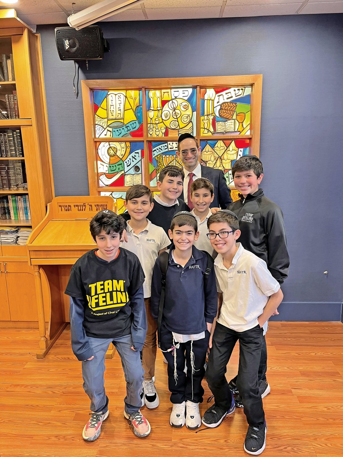 HAFTR Middle School students and Rabbi Chaim Siff raised money for Chai Lifeline. In front, from left, were Judah Rauchwerger, Jacob Hersko and Yosef Haimoff. In back, from left, were Zachary Sternberg, Meir Zrihen, Siff, Jonah Gober and Mordechai Werzberger.