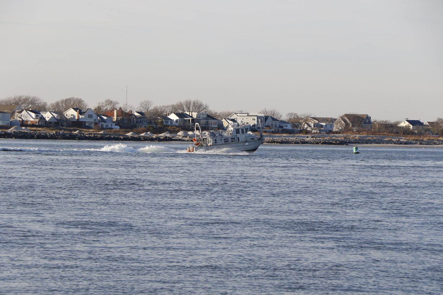 A boater skiffs across Jones Beach Inlet, which federal legislators say is in need of dredging by the U.S. Army Corps of Engineers.