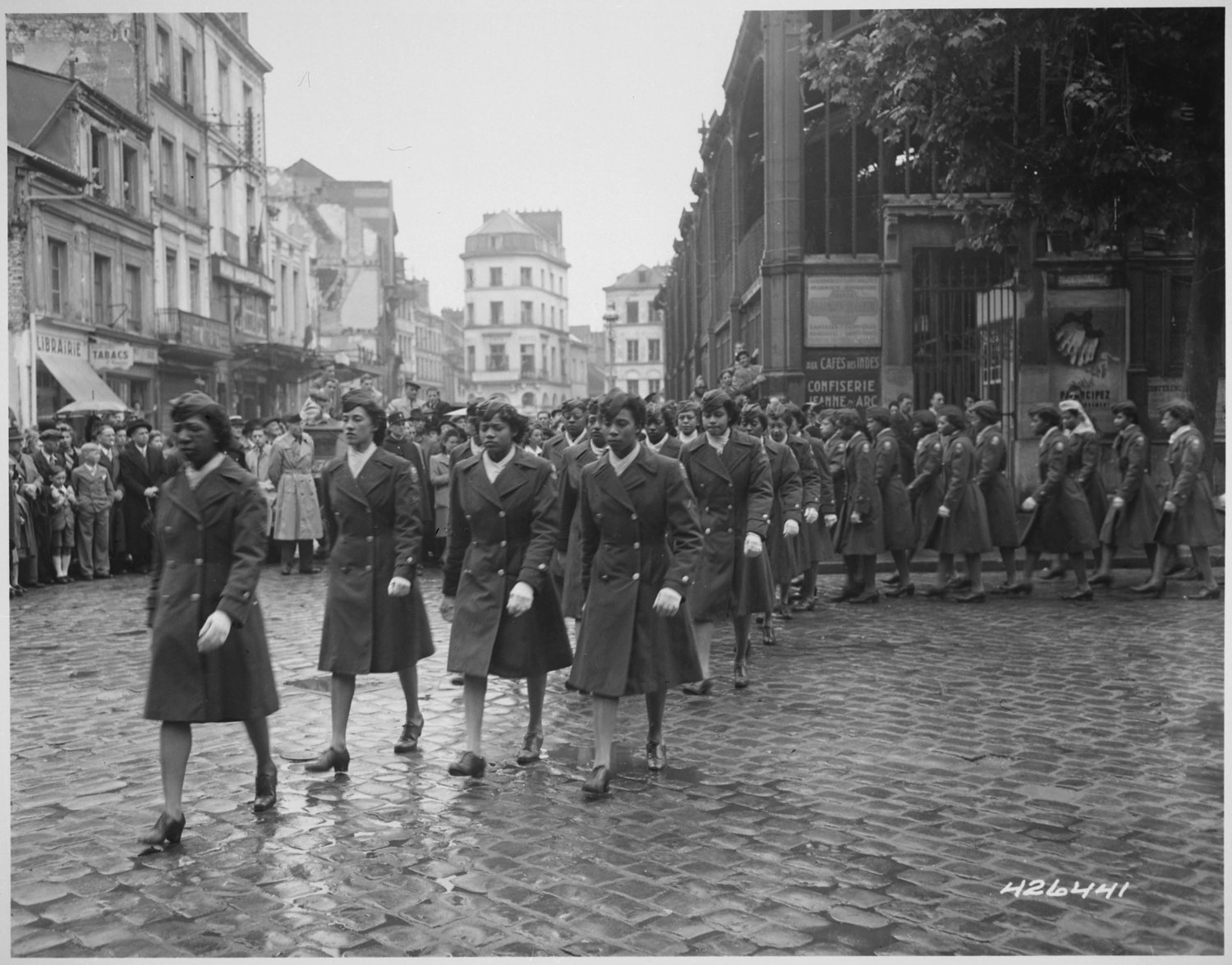Members of the 6888th Central Postal Directory Battalion take part in a parade ceremony in honor of Joan d'Arc.