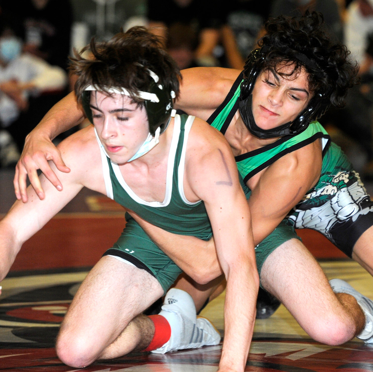 Seaford junior Jack Godoy, right, captured the Division 2 county title at 118 pounds.