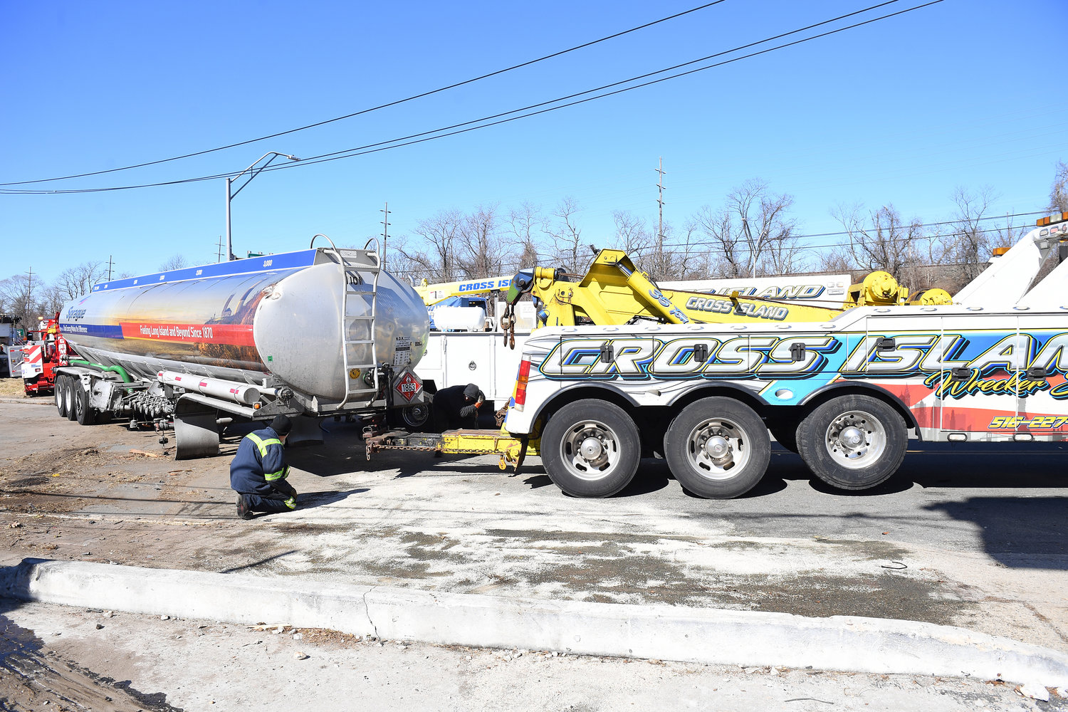 A tractor trailer from Sprague Energy in Lawrence, traveling eastbound on Sunrise Highway, struck a potentially illegally parked car carrier early this morning in Merrick.