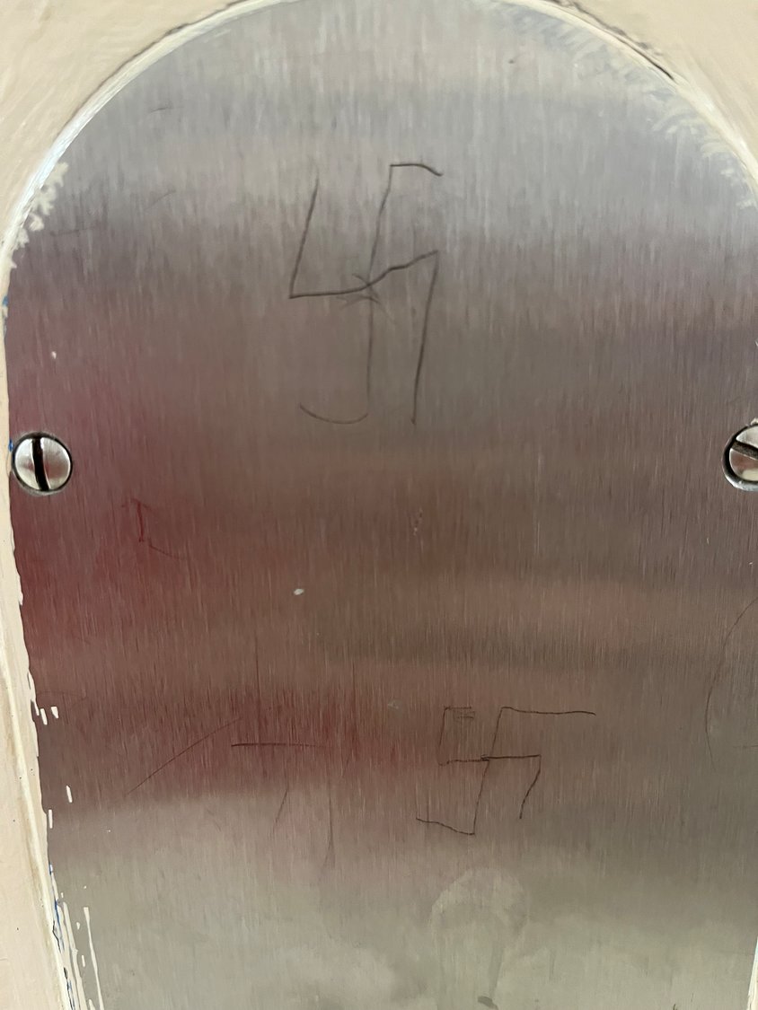 Two swastikas were etched on a metal plate in a hallway of Lawrence Elementary School at the Broadway Campus in Lawrence.