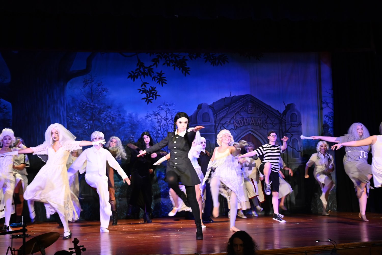 Long Beach High School students (l-r) Sammie Fales as Wednesday, Max Rosenzweig as Pugsley, Patrick O’Neill as Gomez and Ava Lithgow as Morticia.