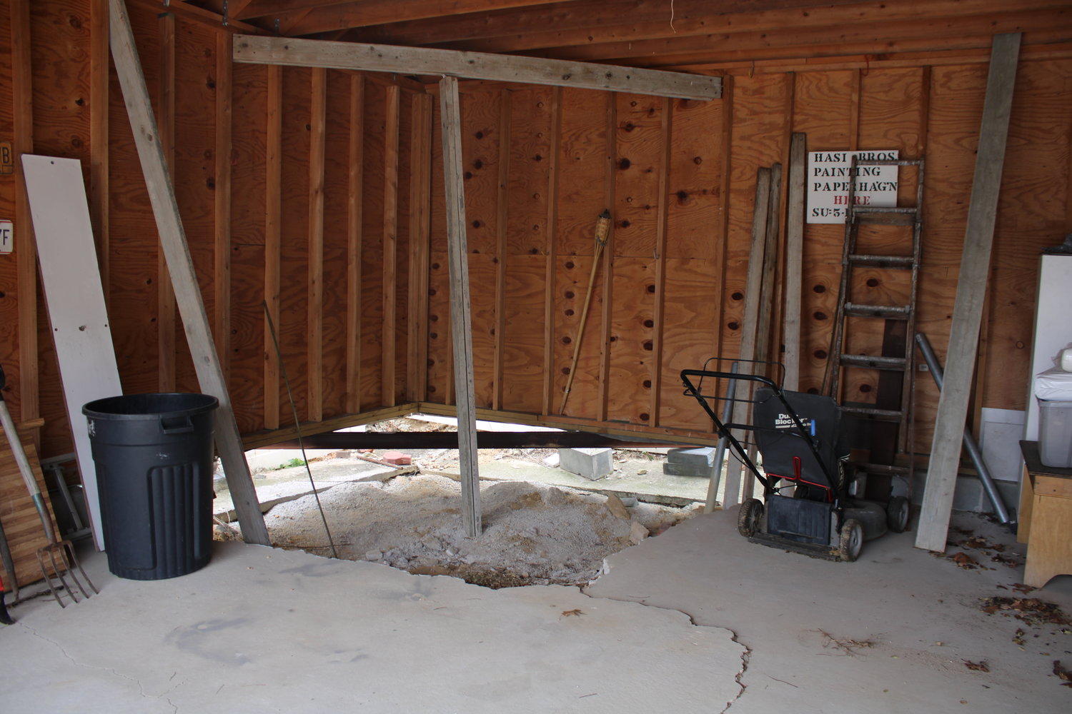 Seaford resident Elma Hasi has a gaping hole in the back corner of her sinking garage, which formed after a contractor attempted to fix it in 2018.