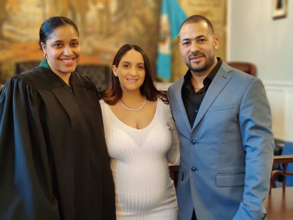 Justice Brianna A. Vaughan, left, married Andrea Martinez and Joel Disla, who are expecting their first child, on March 28.