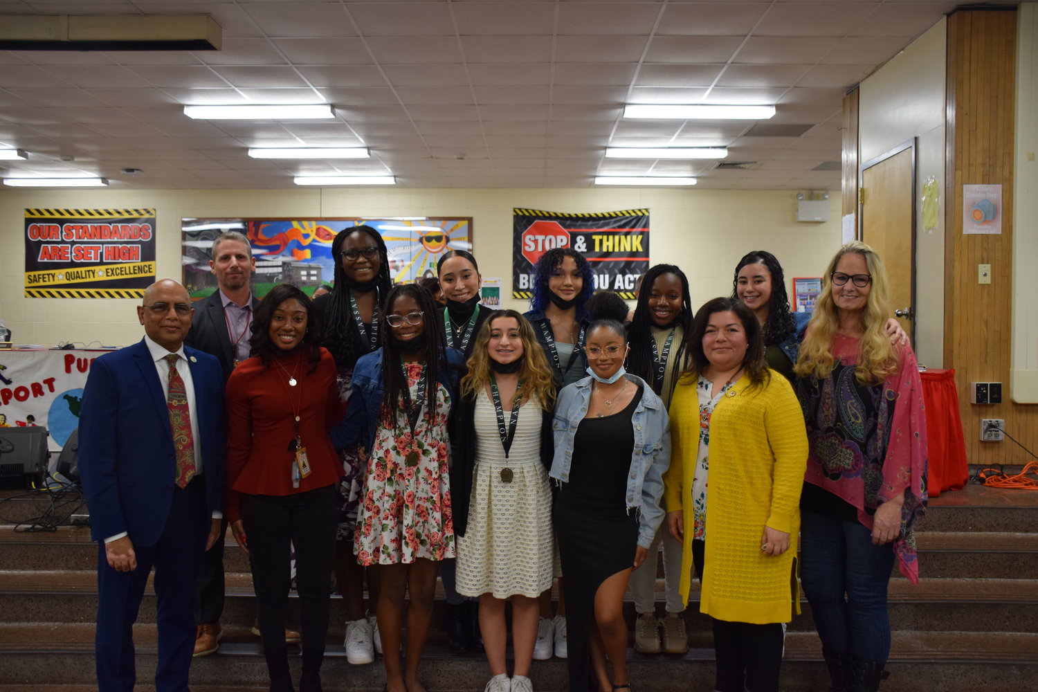 The Freeport Board of Education recognized the varsity cheerleading team, along with coach Laurie Kolodny (right) and assistant coach Erica Groover (second left) at the board of education meeting on March 23.