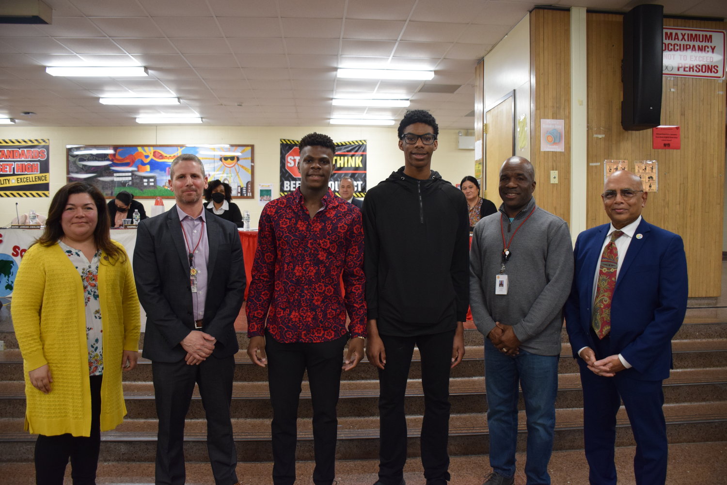 Freeport boys track team members Kazeem Scott (right center), Dorian Boyd (left center) and coach Charles Gilreath (second right) were acknowledged for their outstanding winter sports season by Superintendent of Schools, Dr. Kishore Kuncham (right), Board of Education President Maria-Jordan Awalom (left) and Director of Health, Physical Education and Athletics Jonathan Bloom.