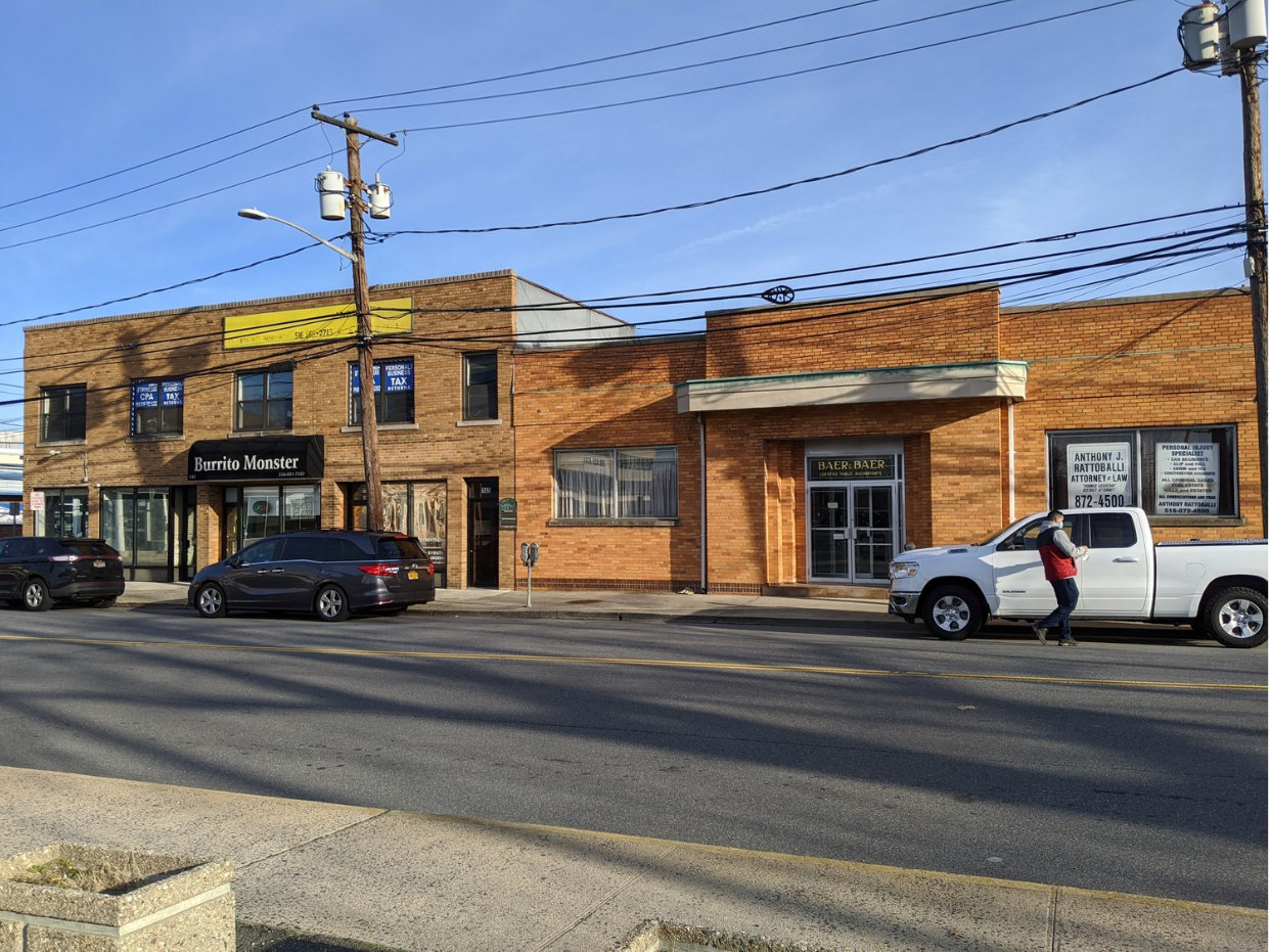 The transit-oriented development project on S. Franklin Avenue will replace this strip of commercial properties with a 35-unit apartment complex.