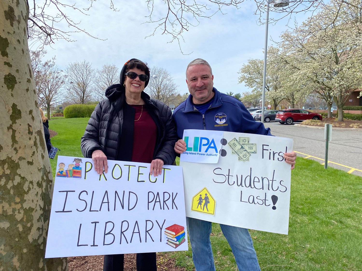 Island Park Library Director Jessica Koenig, left, and Trustee Dean Bacigalupo attended the protest. The LIPA agreement could have severe financial ramifications for library programs.