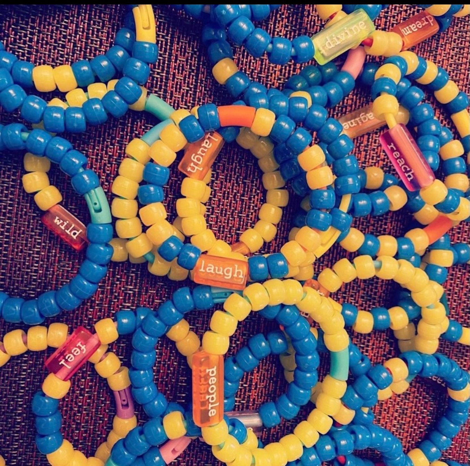 The girls sold a variety of items, including beaded bracelets with positive words on them.