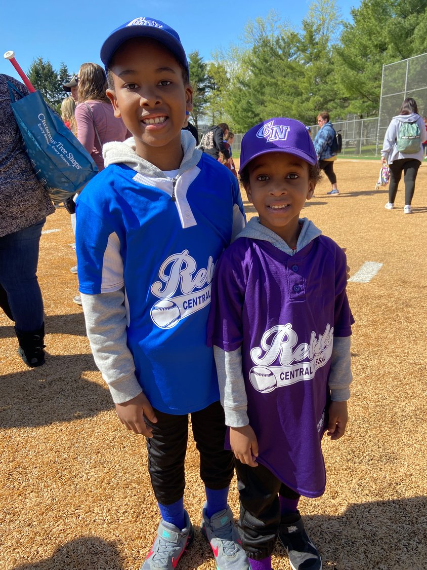 Chase Elson, 7, near right, and his brother, Parker, 5, were all dressed up and ready to take the field for the Central Nassau Athletic Association opening day last Saturday.