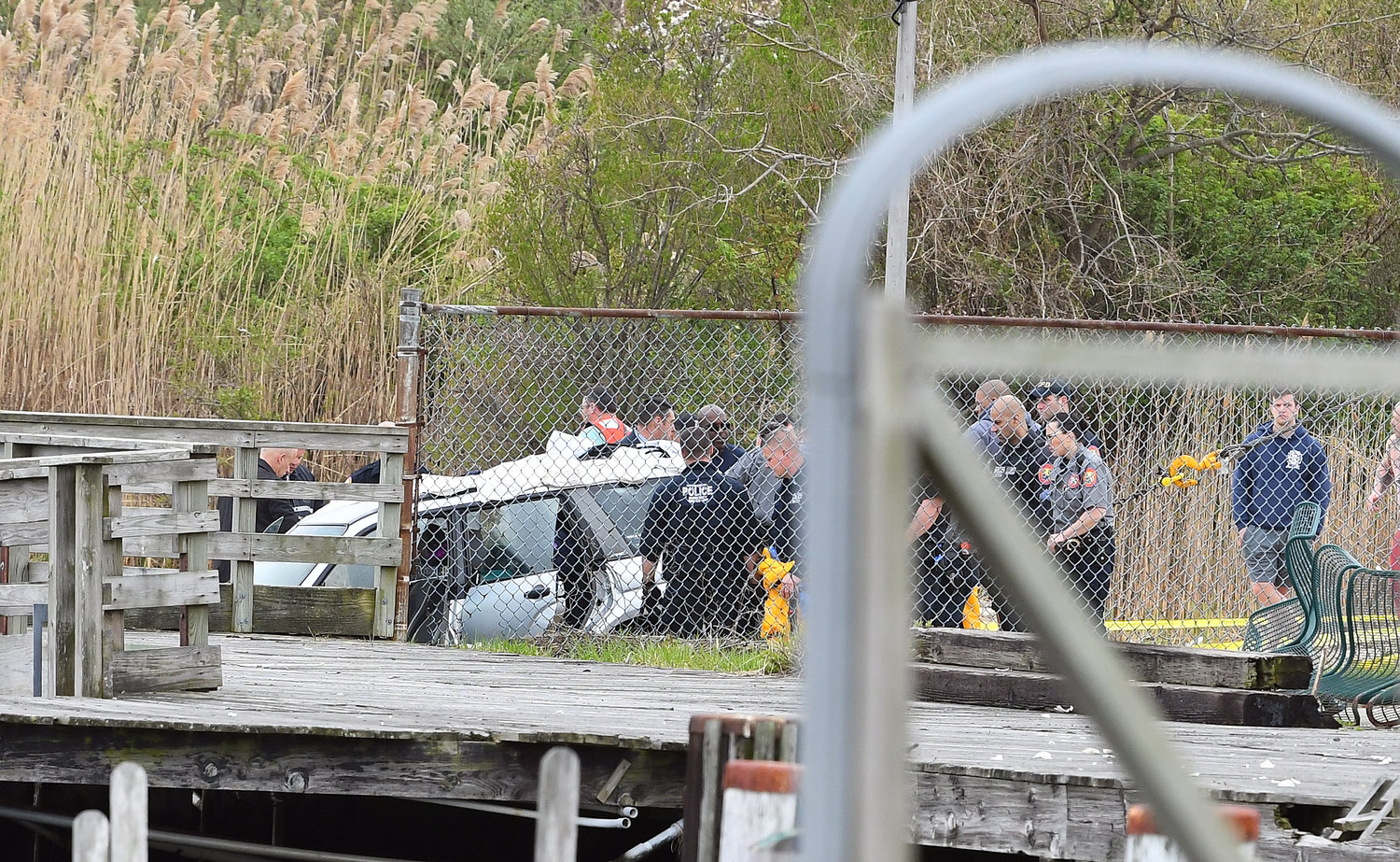 Rescuers hauled out the car that drove into the water off Cow Meadow Park after scuba divers discovered it.