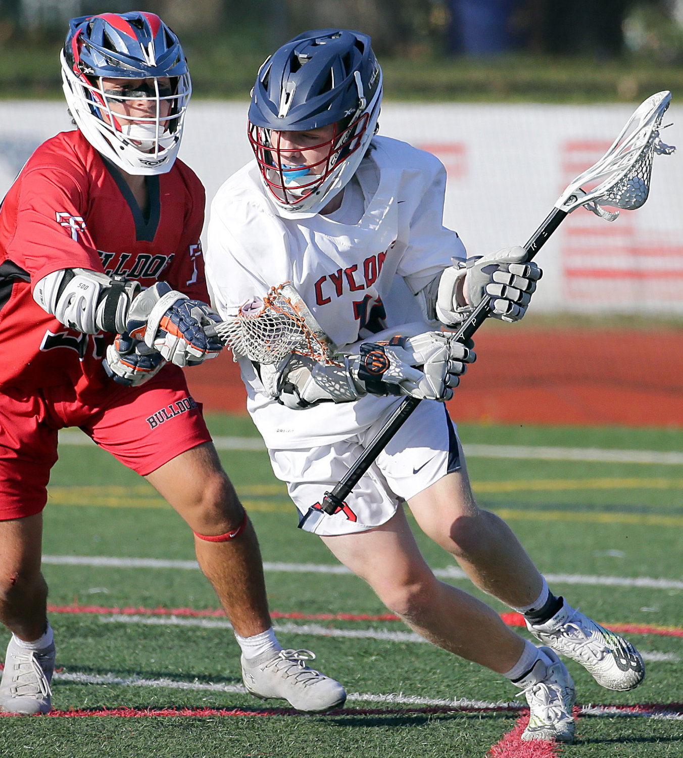 Junior attack Ryan Mayerhofer, right, made a move to the cage during the Cyclones’ 13-4 victory over Island Trees last Friday.