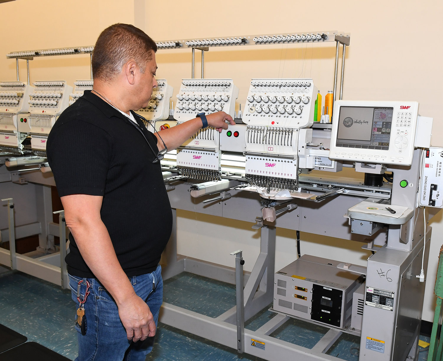Devinson Sanchez demonstrated the complex embroidery machines with which AHRC will develop a new business line.