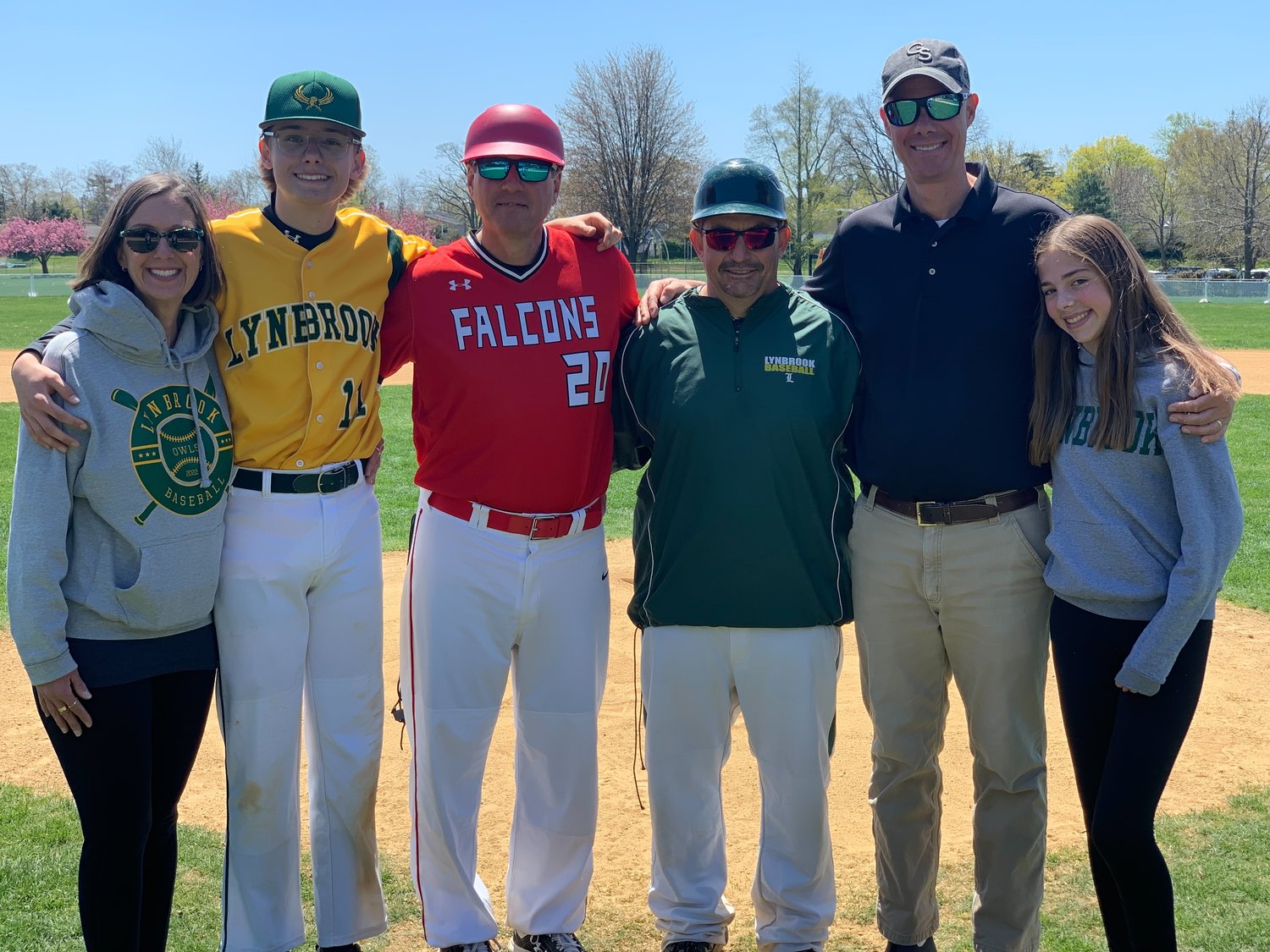 Taking part in the field dedication to late former Lynbrook coach Don Roth were, from left, his daughter, Jane Roth Sloan; his grandson Parker Sloan; his friend Rich Hess; Lynbrook baseball coach Al Marrazzo; Roth’s son, Tim; and his granddaughter Kelsey Roth.
