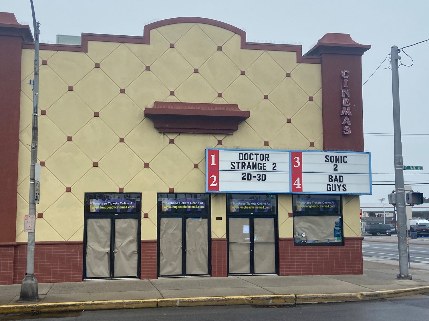 Long Beach cinema 4 now sports an updated marquee showing movies playing inside for the first time in two years.