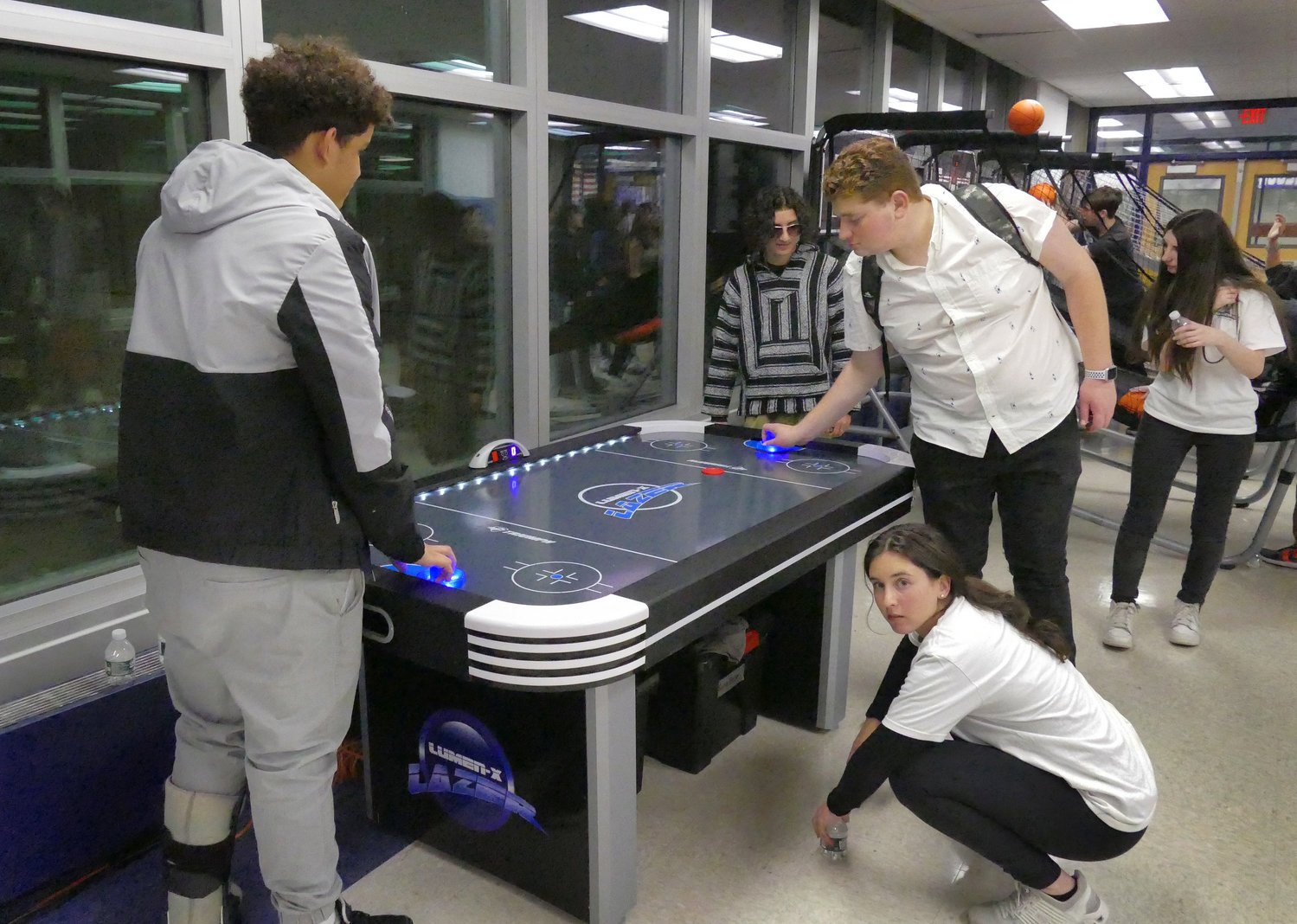 Air hockey was one of the options for students to play at teen night.