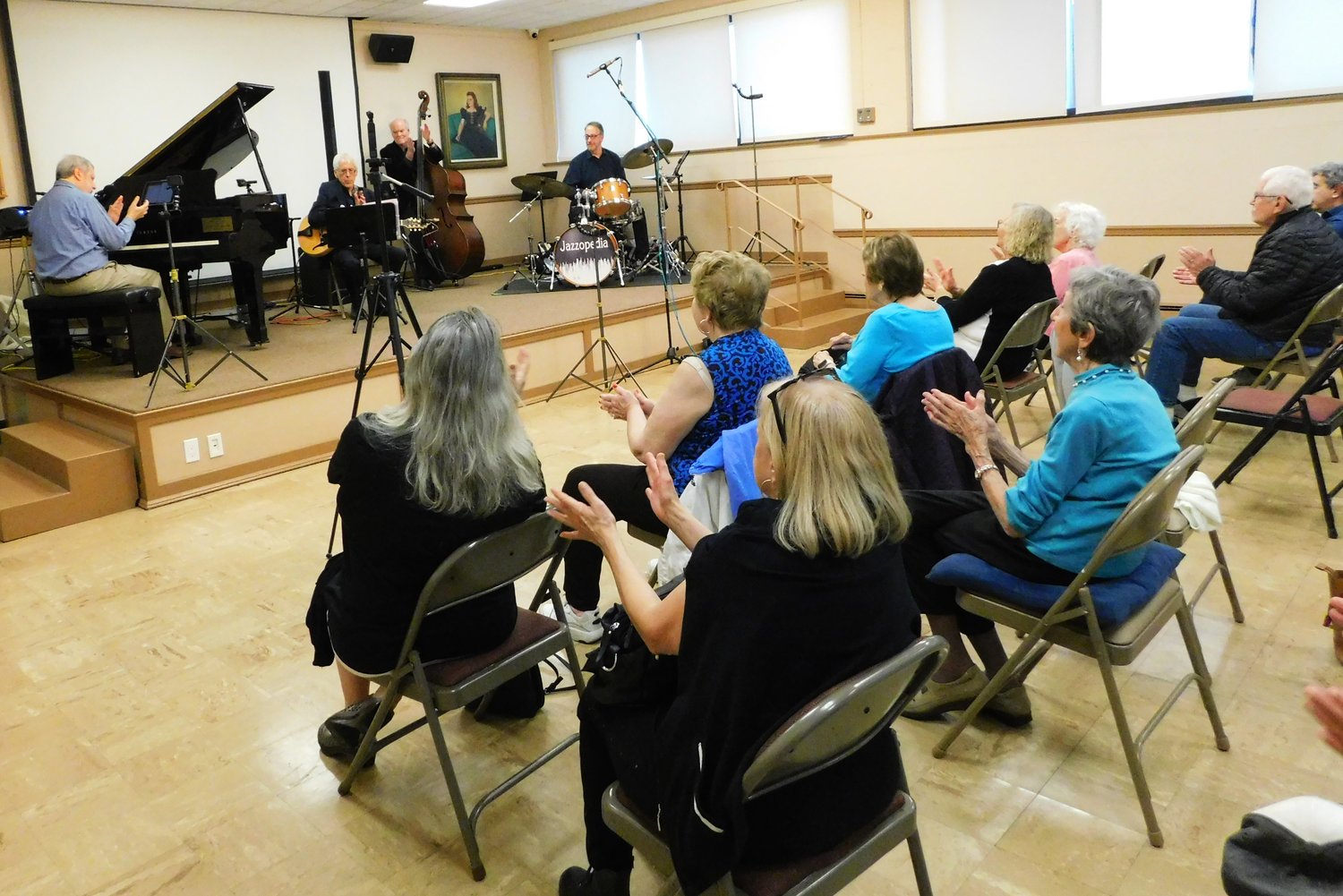 Jazzopedia fans clapped along with pianist Allen Morrison, guitarist Marc Rosen, bass player Edgar Mills, and drummer Brad Sporkin during a Jazzopedia concert at the Freeport Memorial Library on May 1.