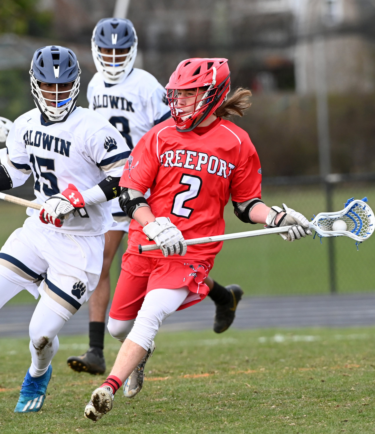 Justin Reinke, right, had a hat trick and two assists to lead the Red Devils to an 8-5 victory at Hempstead on May 3.