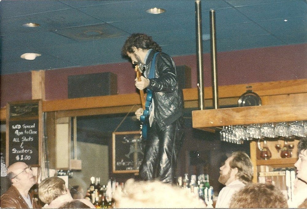 At a 1989 New Year’s Eve performance at Scandals Nightclub in Virginia Beach, Spano had a special signal for the bartender to move the glasses out of the way for his bar-top performance.