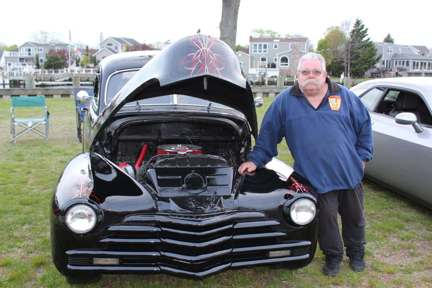 Jerry Brown, who runs the Every Thursday Night car meet, above with his 1948 Chevy, whose pinstriping was done by Gary ‘the local brush’ Kupfer.