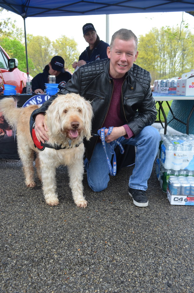 Sparky and his handler, Gene Smith, came to Eisenhower Park to help out at the Vets2Vets Mobile Veterinary Clinic last Friday.