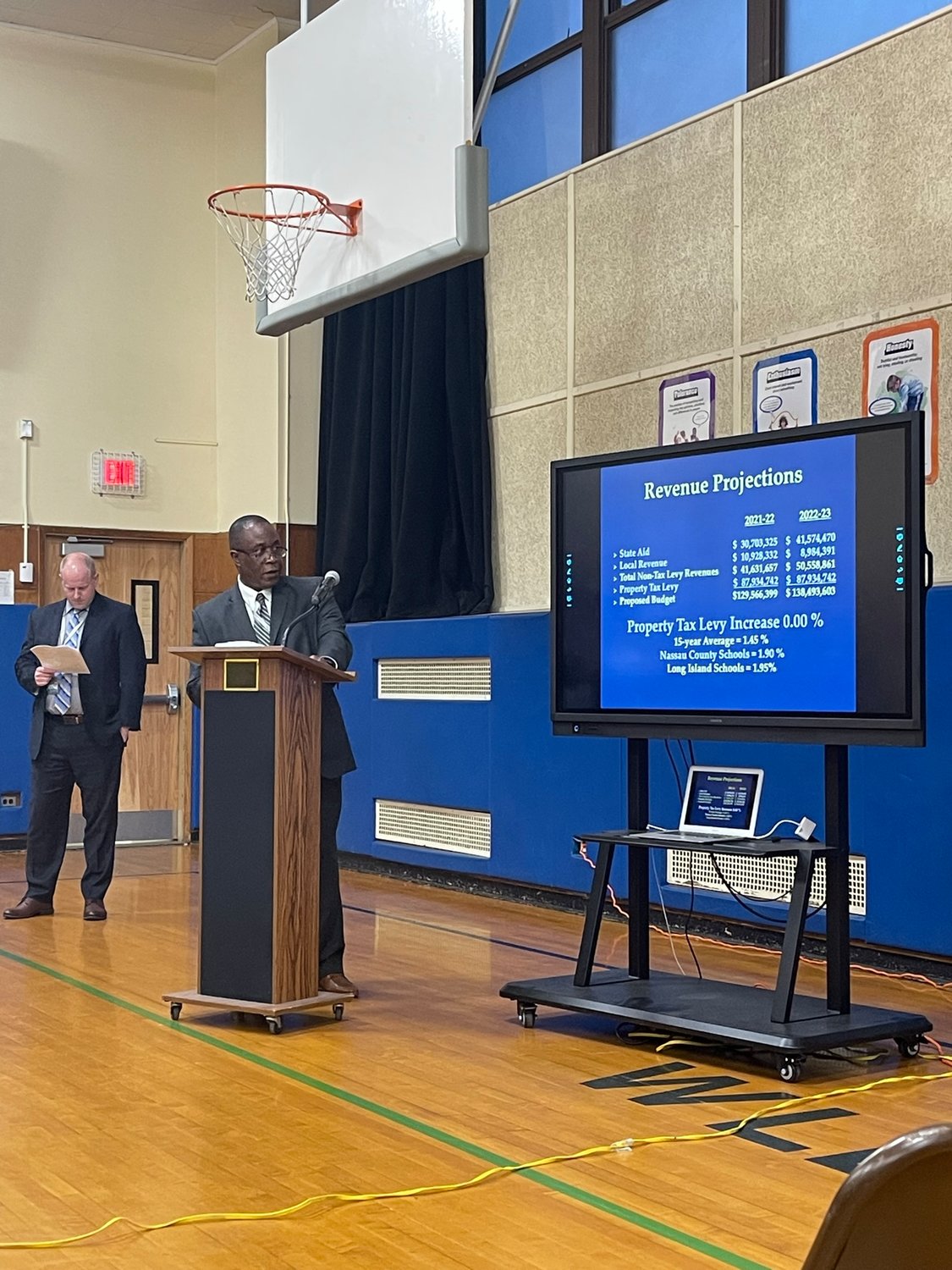 Emmanuel Glasu, Interim assistant superintendent for finance and operations, delivered a budget hearing presentation to the District 24 Board of Education.