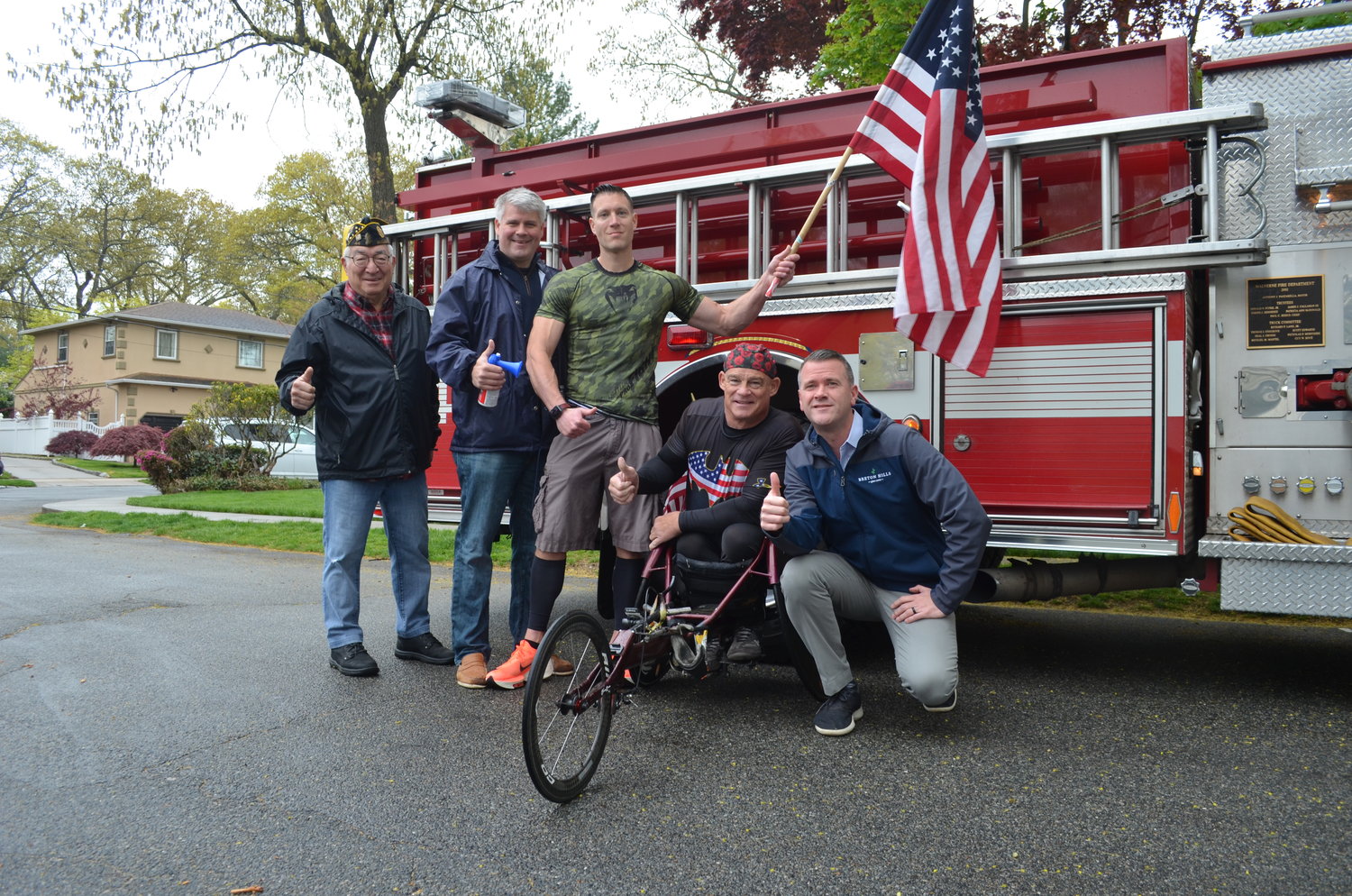 The Village of Malverne and American Legion Post 44 teamed up with local athletes to raise money for veterans and first responders. From left above were post Commander Tony Marino, Mayor Keith Corbett, “Patriot Man” Greg Waxman, wheelchair athlete Peter Hawkins and village Trustee Timothy Sullivan.