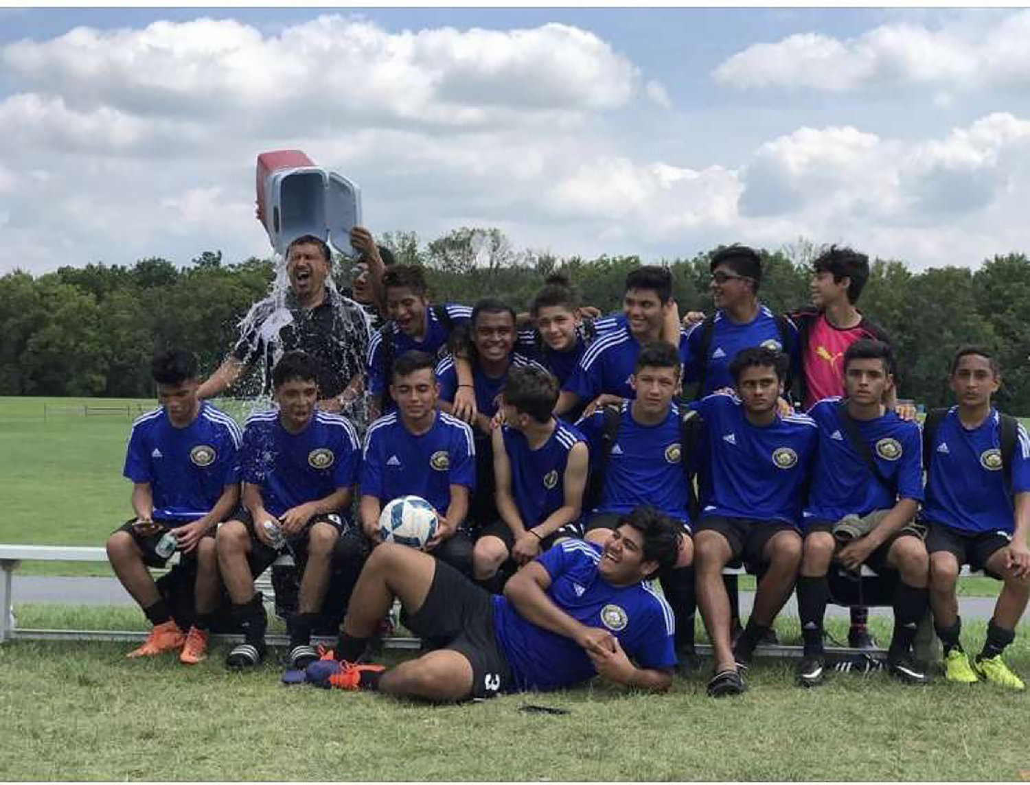 Coach Marlon Navarro had a bucket of water poured on him as a prank during a team photo when Luis Magana was in the club four years ago.