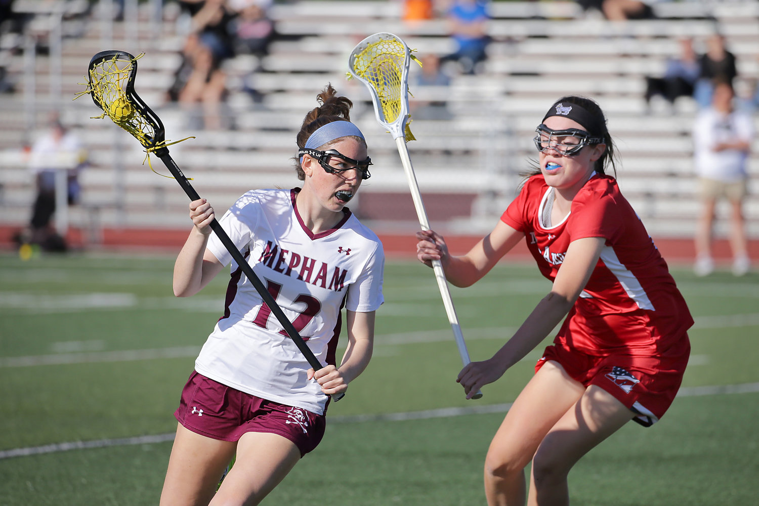 Mepham's Mia McElwee, left, tried to work around MacArthur's Eve Larkin during Wednesday's Class B playoff game.