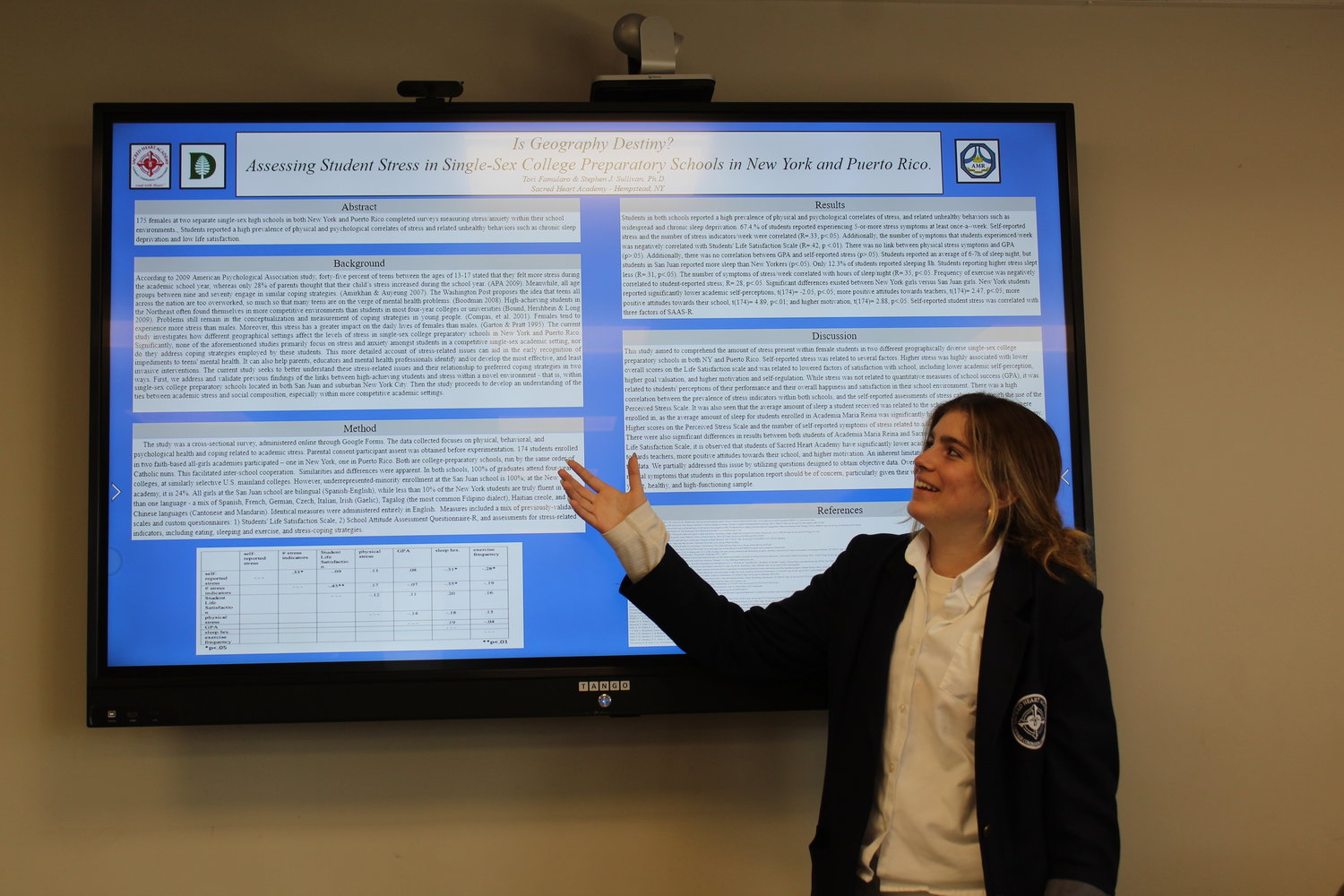 Tori Famularo shows off her research, titled “The Kids Are *Not* Alright: Assessing Student Stress in Single-Sex College Preparatory Schools in New York & Puerto Rico.”
