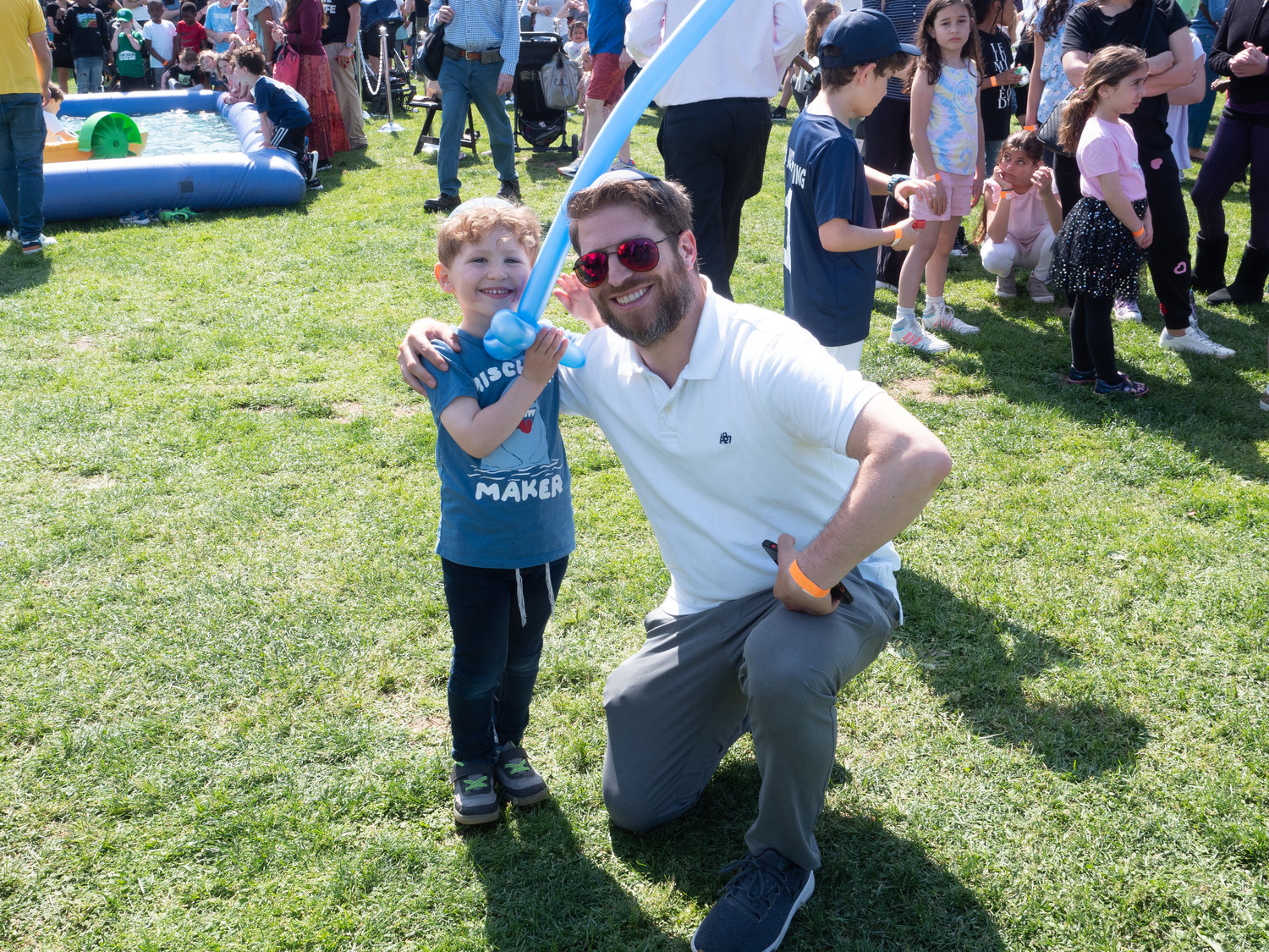 Simcha Smith, 4, showed off his balloon sword with his father, Aryeh Smith.