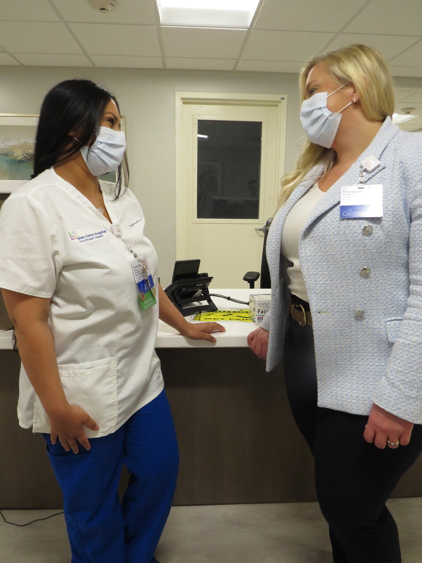 Theresa Dillman, far left, associate executive director of patient care services, spoke with RN and nurse educator Sharda Haridat about the clinical practice for continued nurse training at Glen Cove Hospital.